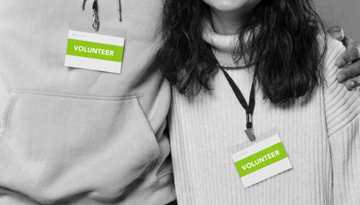 people-with-volunteering-badges