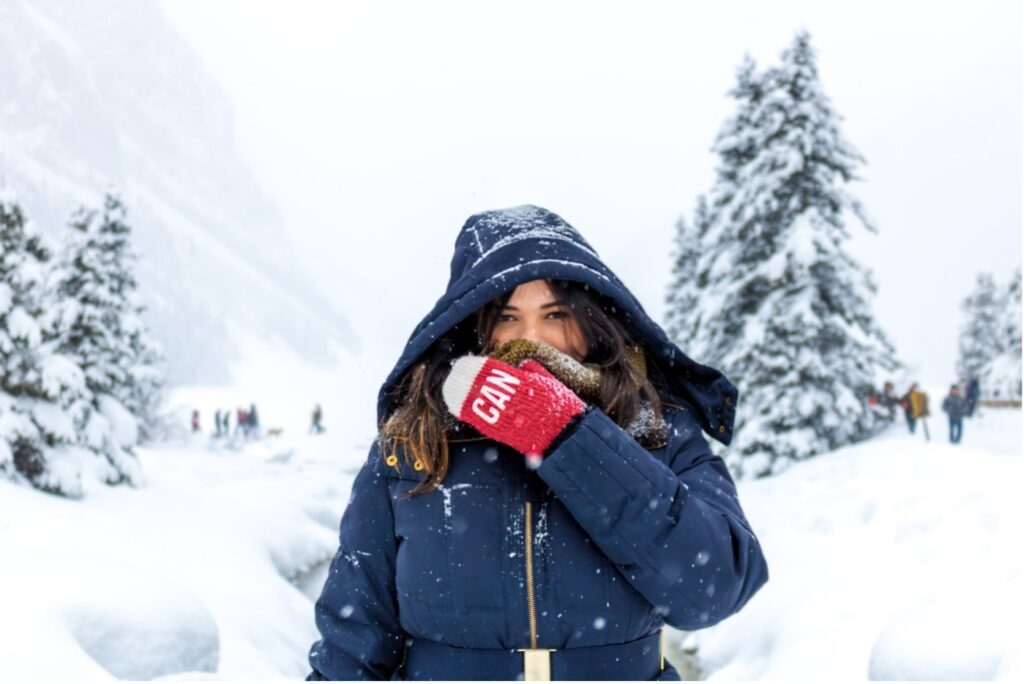 woman-in-coat-in-snow-natural-ways-to-stay-healthy-winter