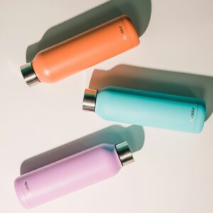 3-water-bottles-purples-teal-orange-lying-down