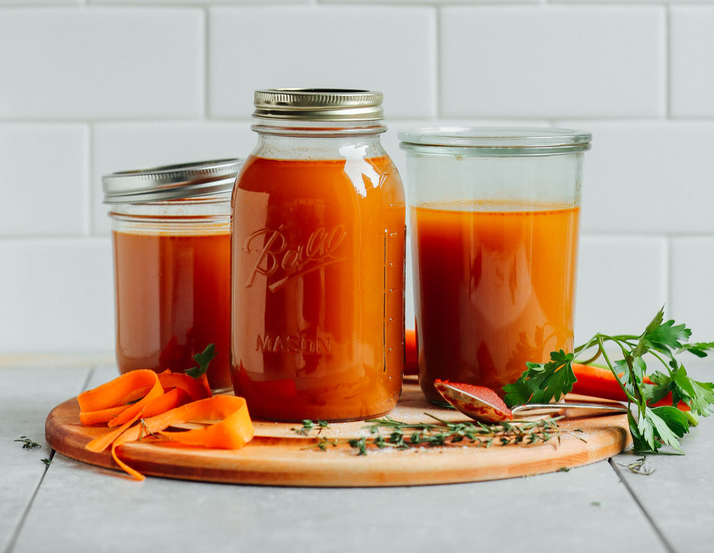 vegetable-broth-pots-tiled-background