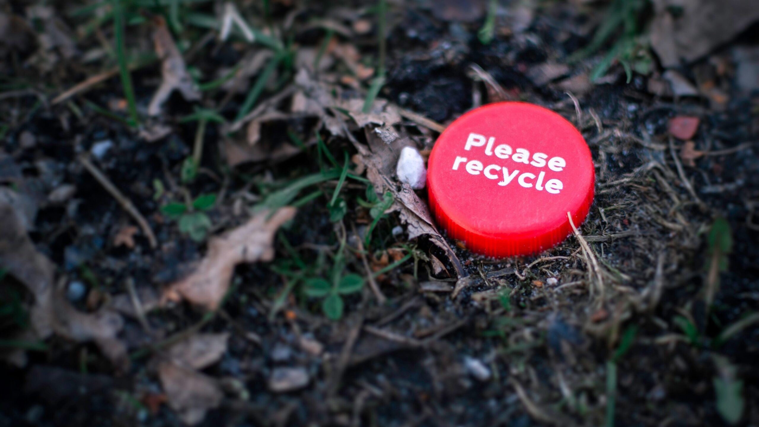please-recycle-red-cap-on-soil