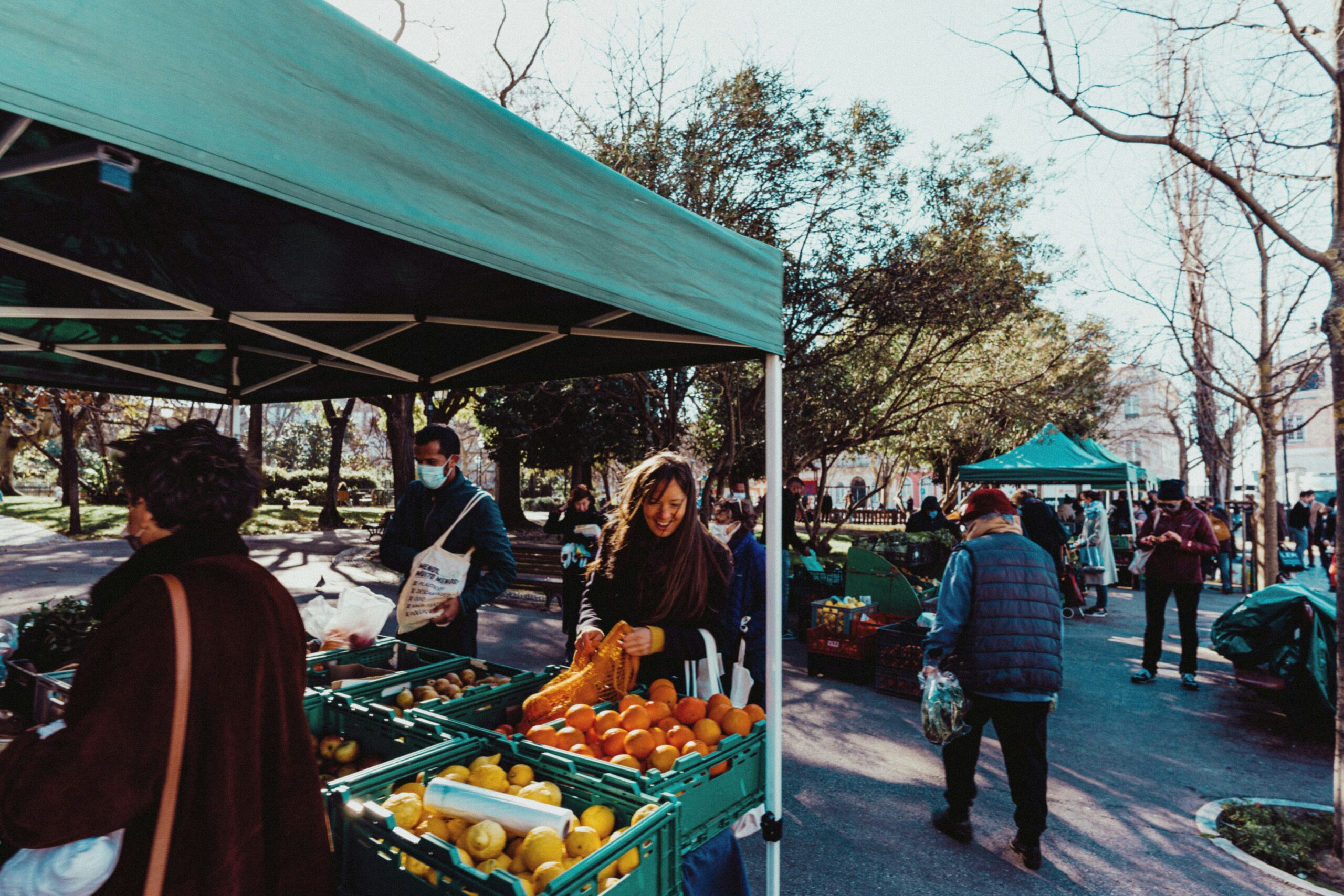 people-at-farmers'-markets-taking-produce