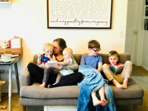 family-of-five-reading-on-couch