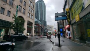 montreal-quebec-city-streets-with-street-post-sign-and-buildings-on-rainy-day