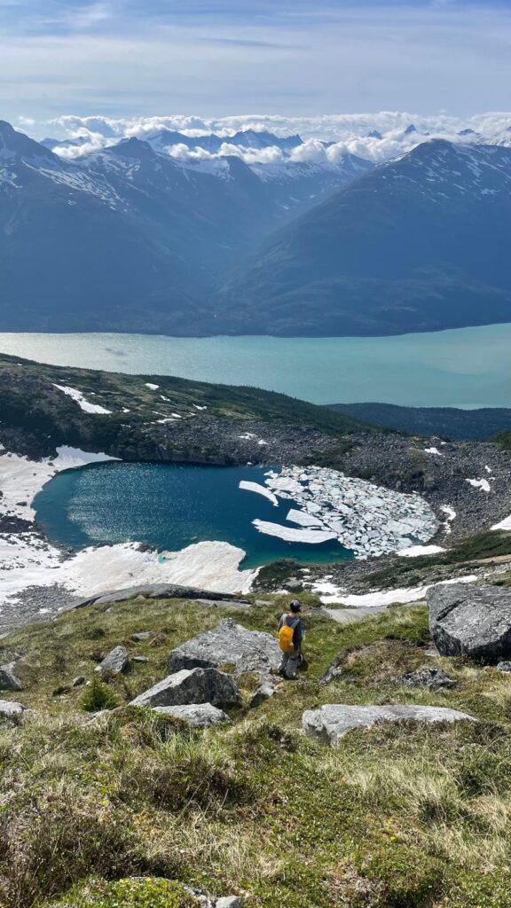 photo-of-mountains-lake-and-grassy-area