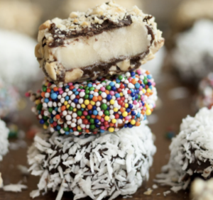 chocolate banana bites with coconut flakes and rainbow sprinkles