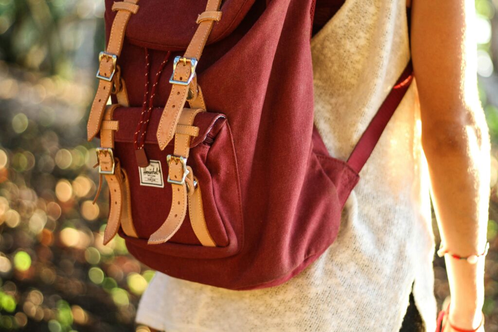 Person with backpack outdoors