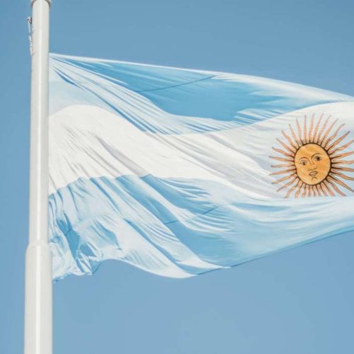 flag-of-argentina-against-blue-background