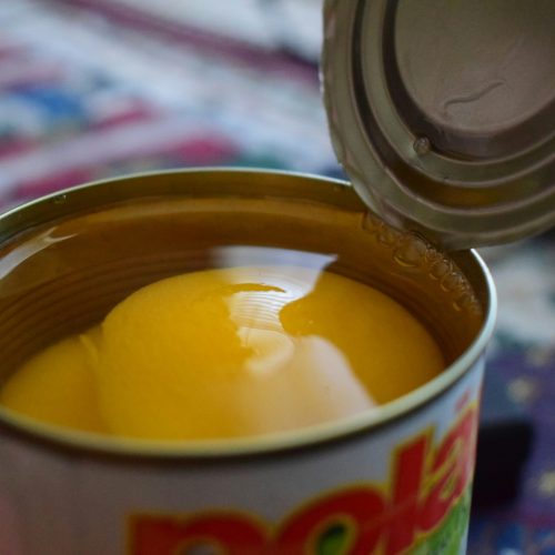 open metal can of fruit