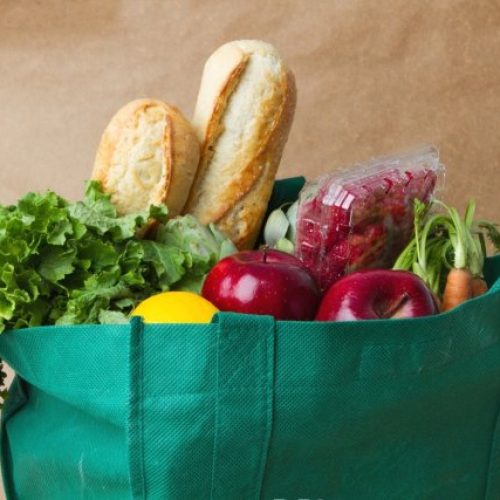 reusable-grocery-bag-full-of-produce-and-baguettes
